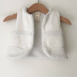 First Impressions Soft White Sherpa 6-9 Months Baby Vest